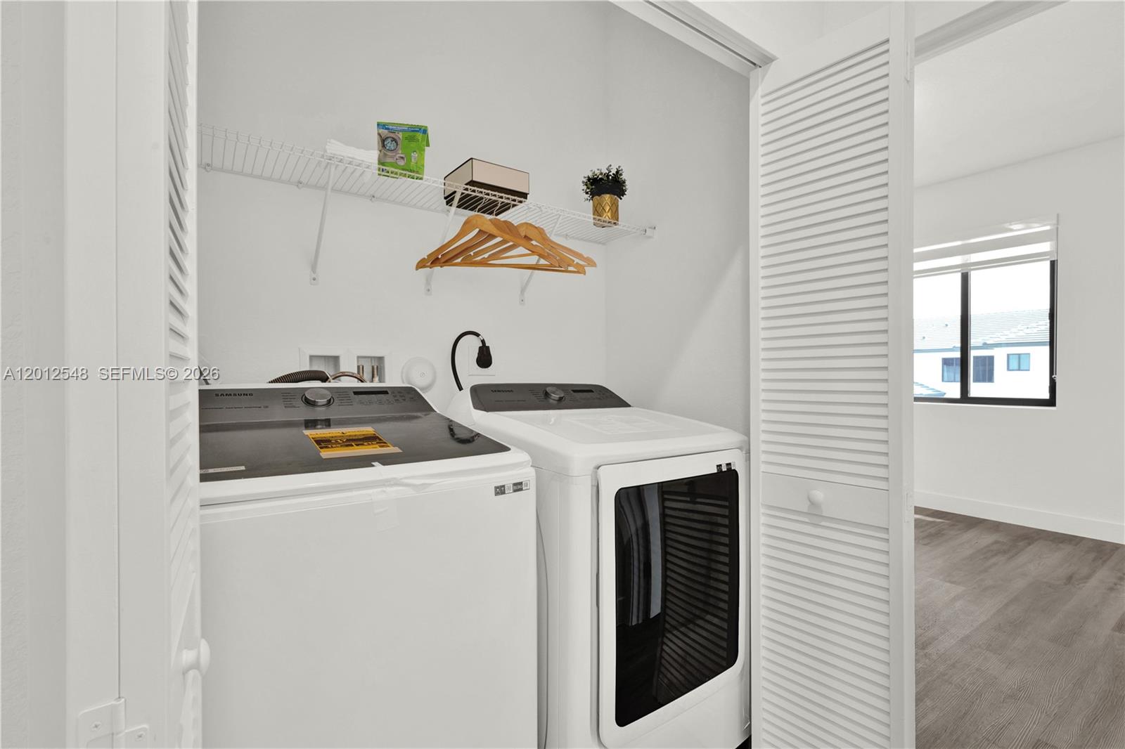 13642 Southwest 157th Place, Unit 13642 Miami, FL 33196 - Photo 35 of 41 a utility room with dryer and washer