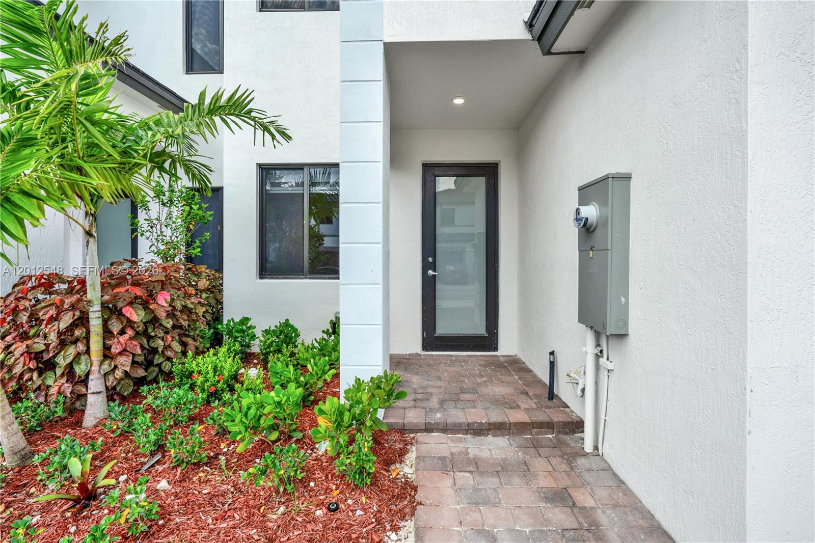 13642 Southwest 157th Place, Unit 13642 Miami, FL 33196 - Photo 4 of 41 view of a entryway door front of house