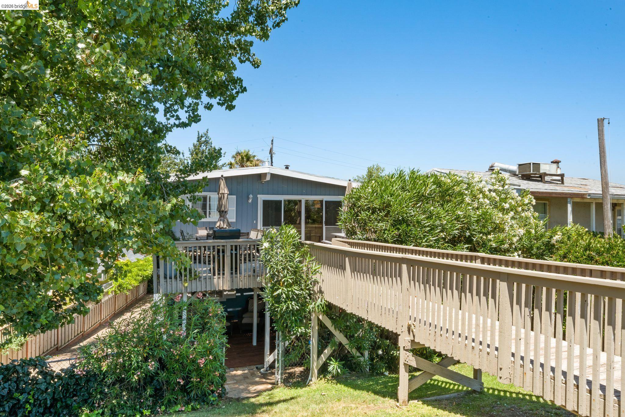 1704 Taylor Road Bethel Island, CA 94511 - Photo 41 of 73 Elevated wood deck with railing and direct access to a separate wooden walkway