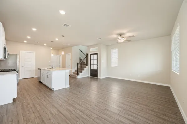 a kitchen with a sink stainless steel appliances and cabinets