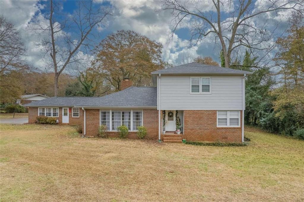 425 Scott Street Commerce, GA 30529 - Photo 1 of 1 front view of a house with a yard