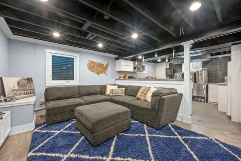 a living room with furniture and a rug