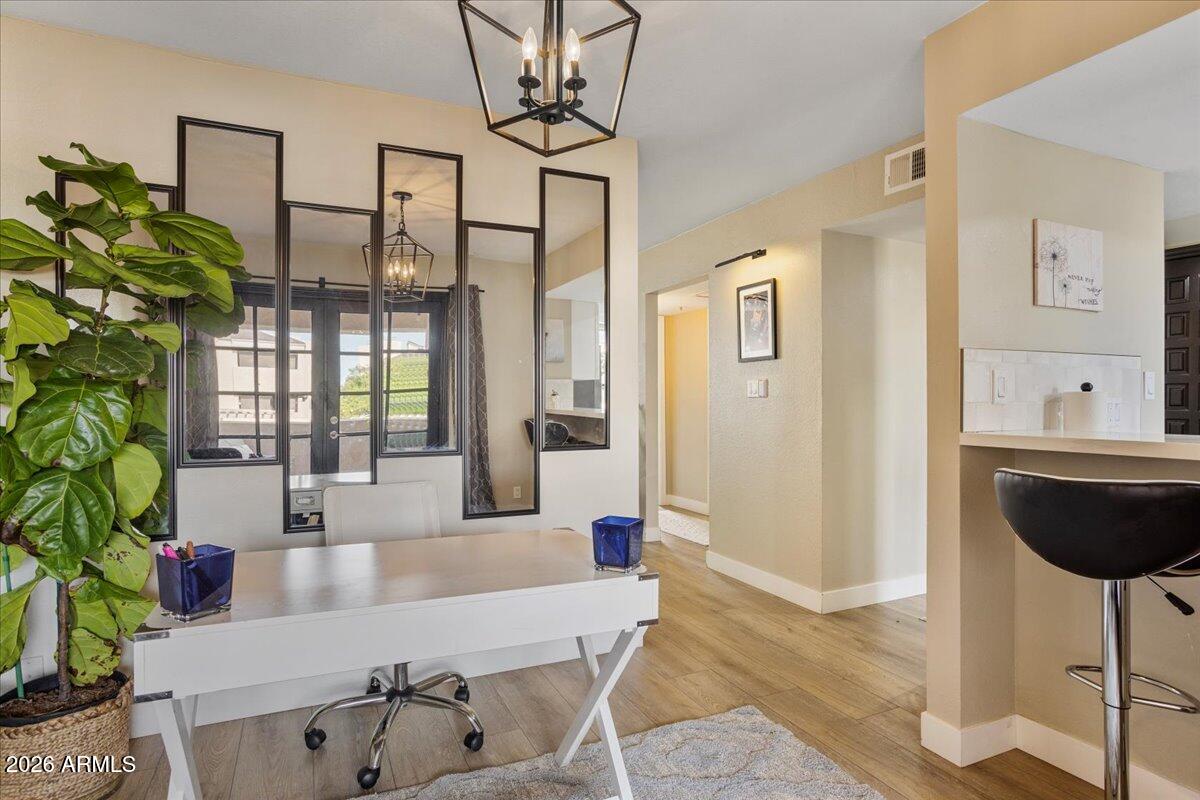 7510 East Thomas Road, Unit 216 Scottsdale, AZ 85251 - Photo 10 of 19 a living room with furniture and a potted plant