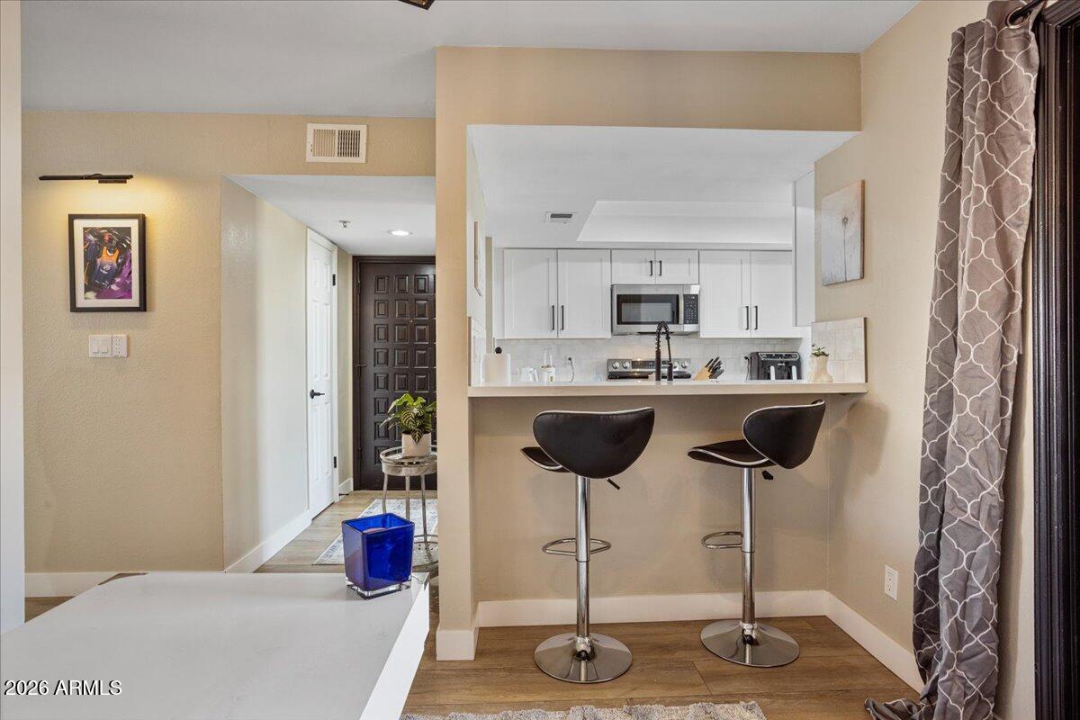 7510 East Thomas Road, Unit 216 Scottsdale, AZ 85251 - Photo 14 of 19 a kitchen with a sink and cabinets
