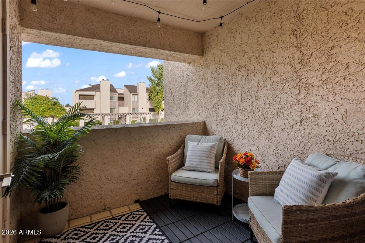 7510 East Thomas Road, Unit 216 Scottsdale, AZ 85251 - Photo 18 of 19 a room with furniture and a potted plant