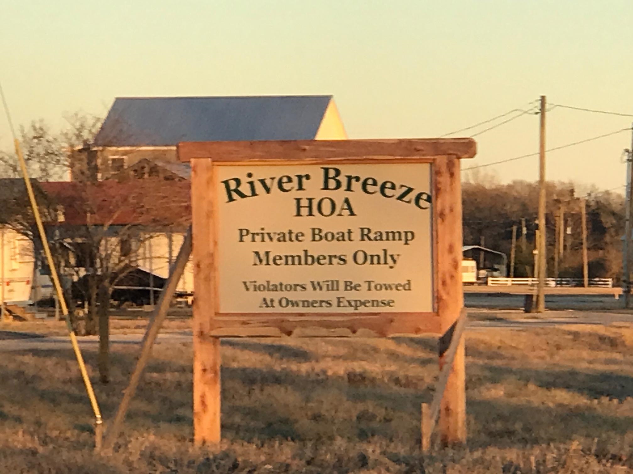 123 Catfish Lane Crump, TN 38327 - Photo 4 of 8 a sign on the side of a building