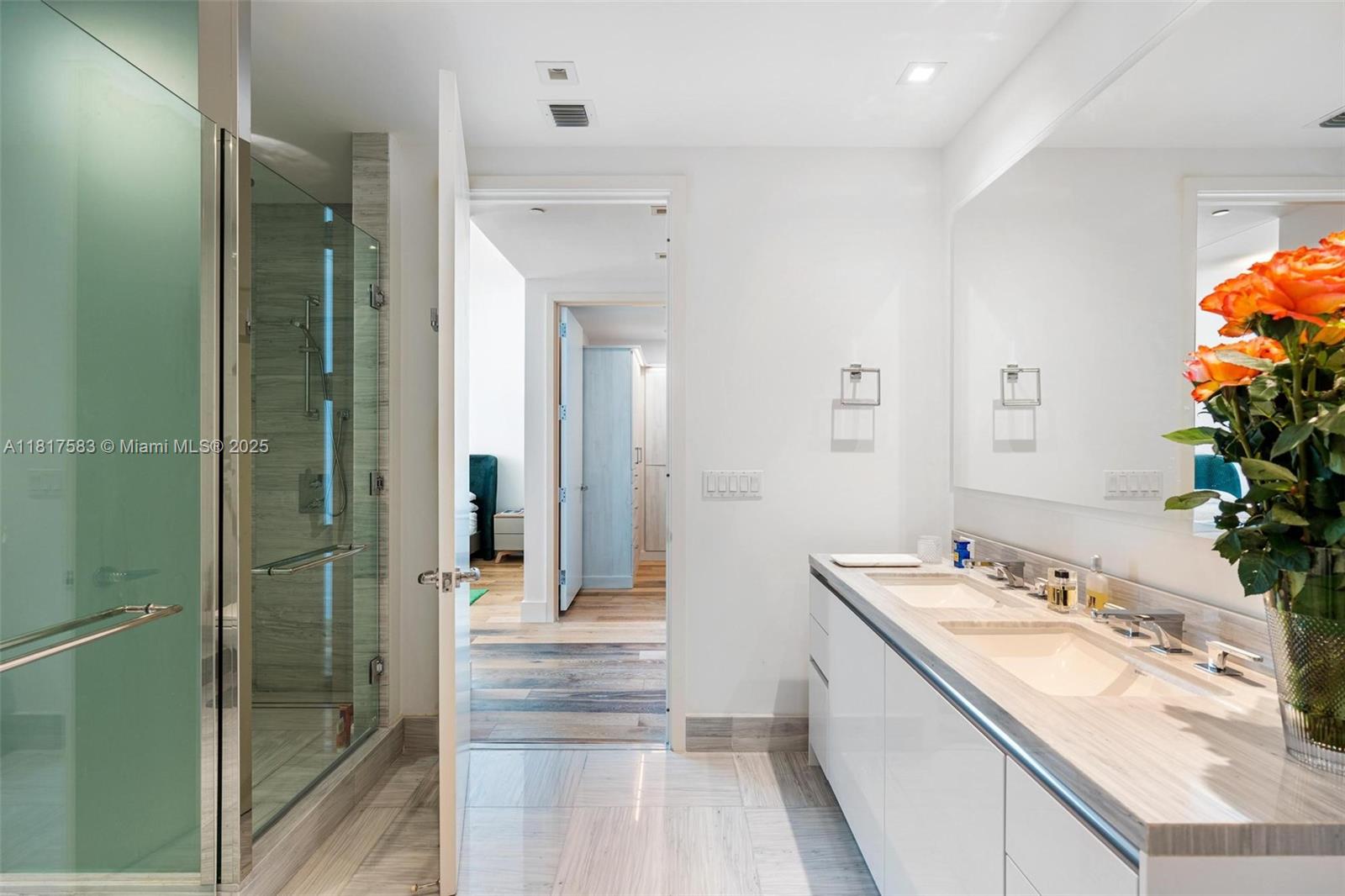16901 Collins Avenue, Unit 902 Sunny Isles Beach, FL 33160 - Photo 18 of 52 a bathroom with a sink and a mirror