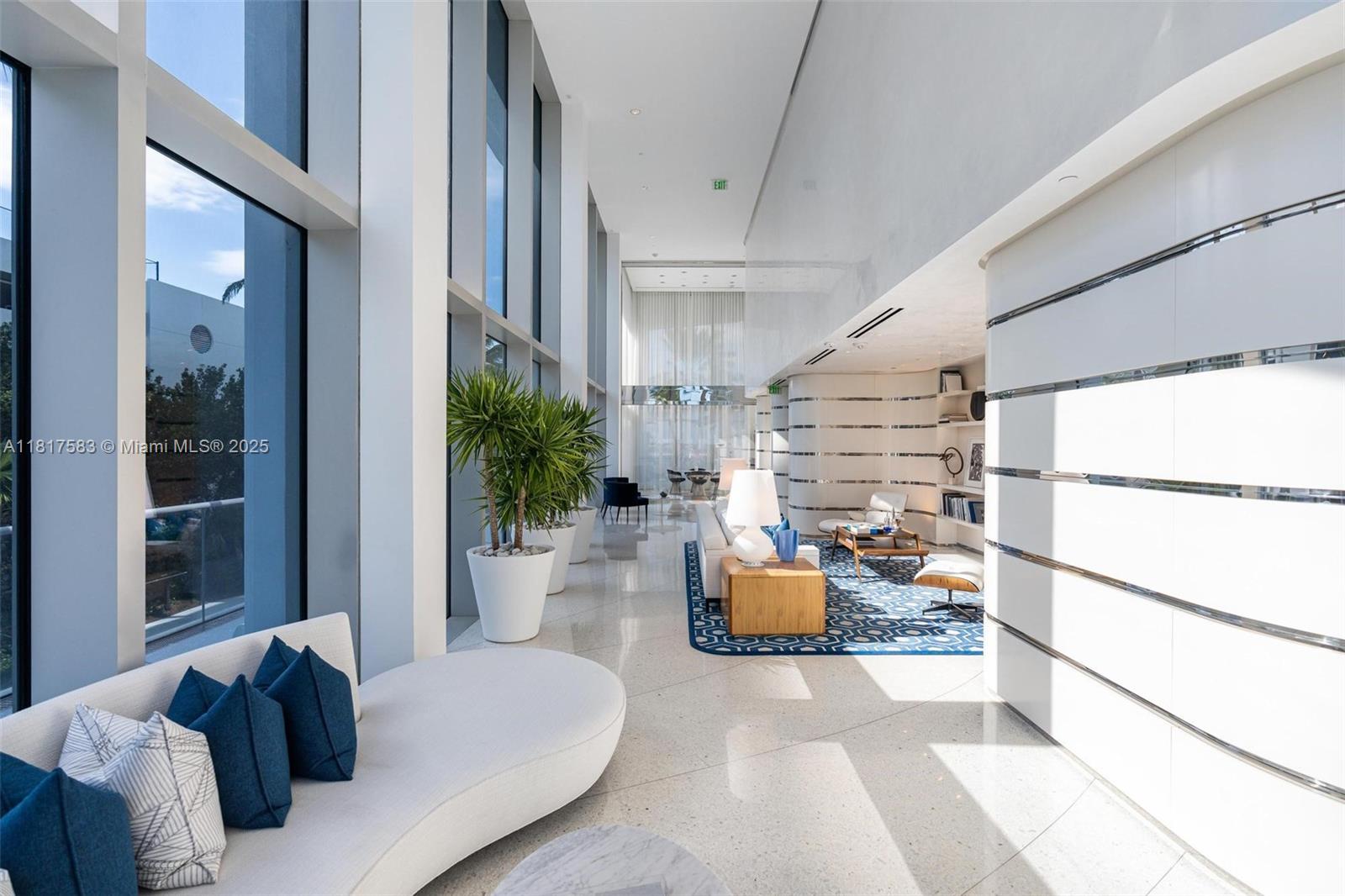 16901 Collins Avenue, Unit 902 Sunny Isles Beach, FL 33160 - Photo 33 of 52 a living room with furniture and a large window