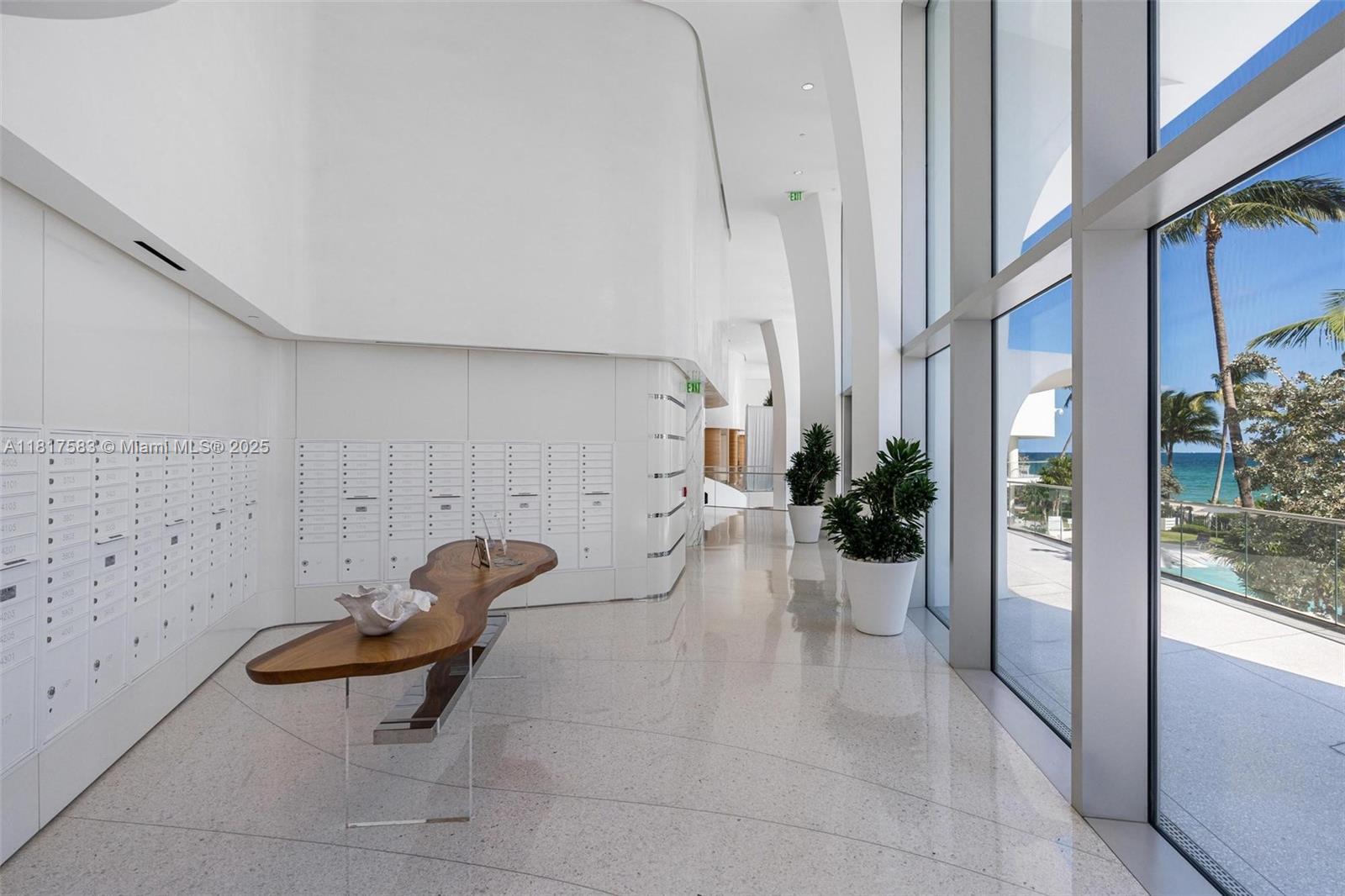 16901 Collins Avenue, Unit 902 Sunny Isles Beach, FL 33160 - Photo 36 of 52 a view of a room with furniture and floor to ceiling window