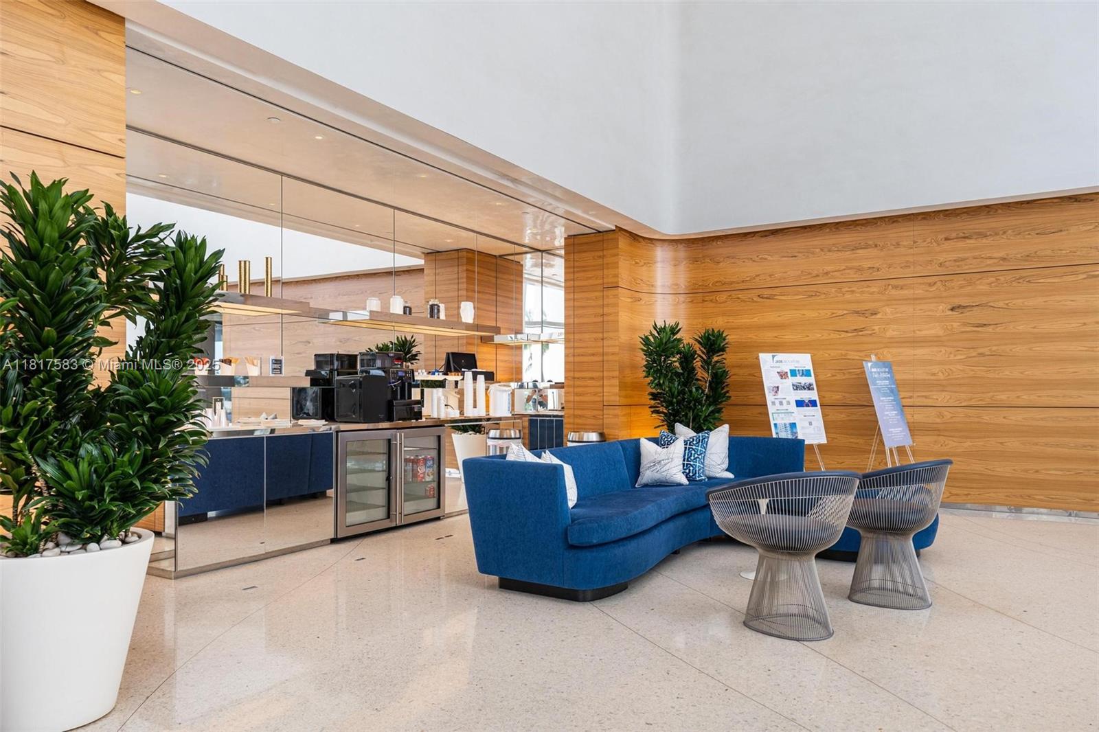 16901 Collins Avenue, Unit 902 Sunny Isles Beach, FL 33160 - Photo 37 of 52 a living room with furniture and a large window