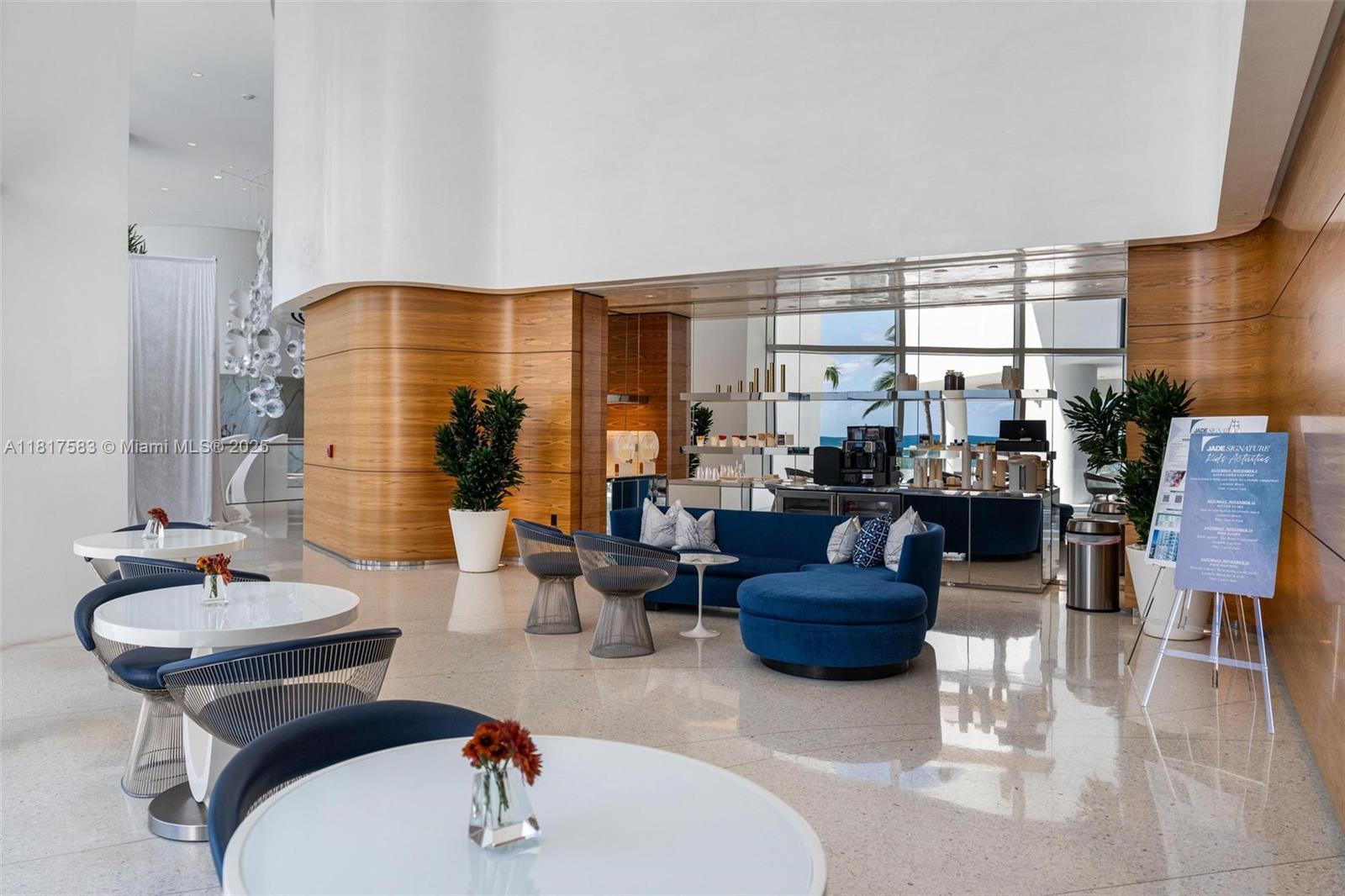 16901 Collins Avenue, Unit 902 Sunny Isles Beach, FL 33160 - Photo 38 of 52 a living room with furniture and a large window