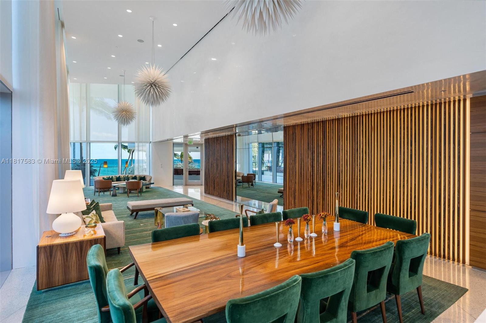 16901 Collins Avenue, Unit 902 Sunny Isles Beach, FL 33160 - Photo 40 of 52 a dining room with furniture and wooden floor