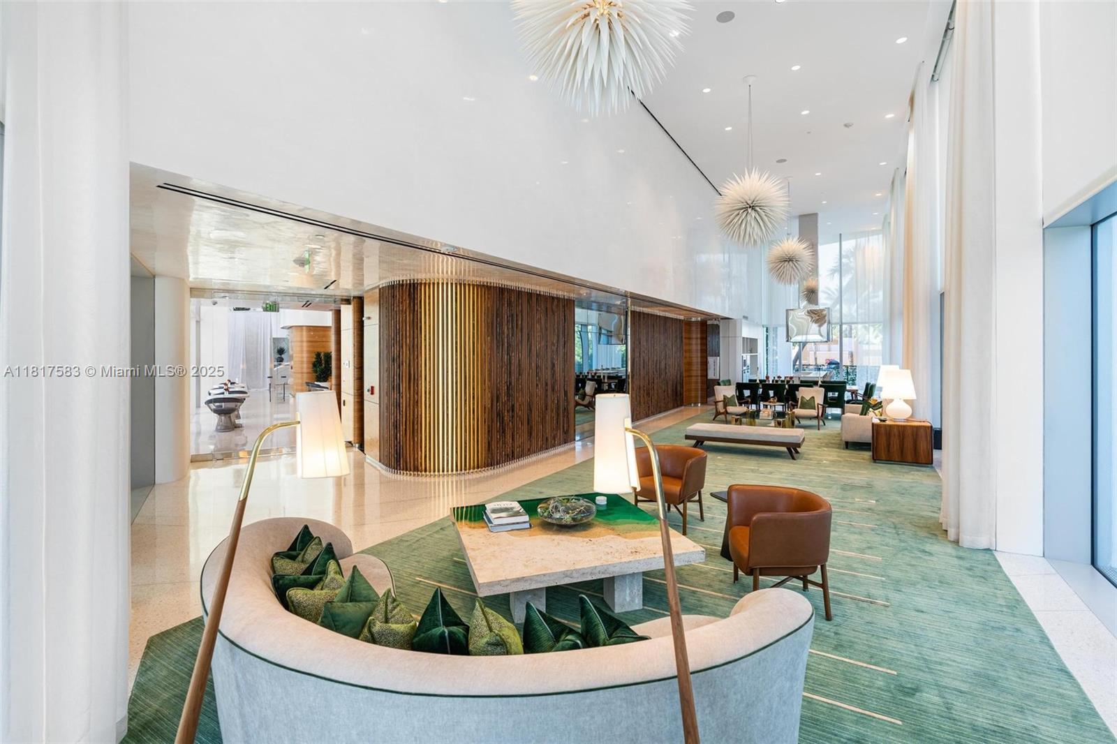 16901 Collins Avenue, Unit 902 Sunny Isles Beach, FL 33160 - Photo 41 of 52 a living room with furniture and a table