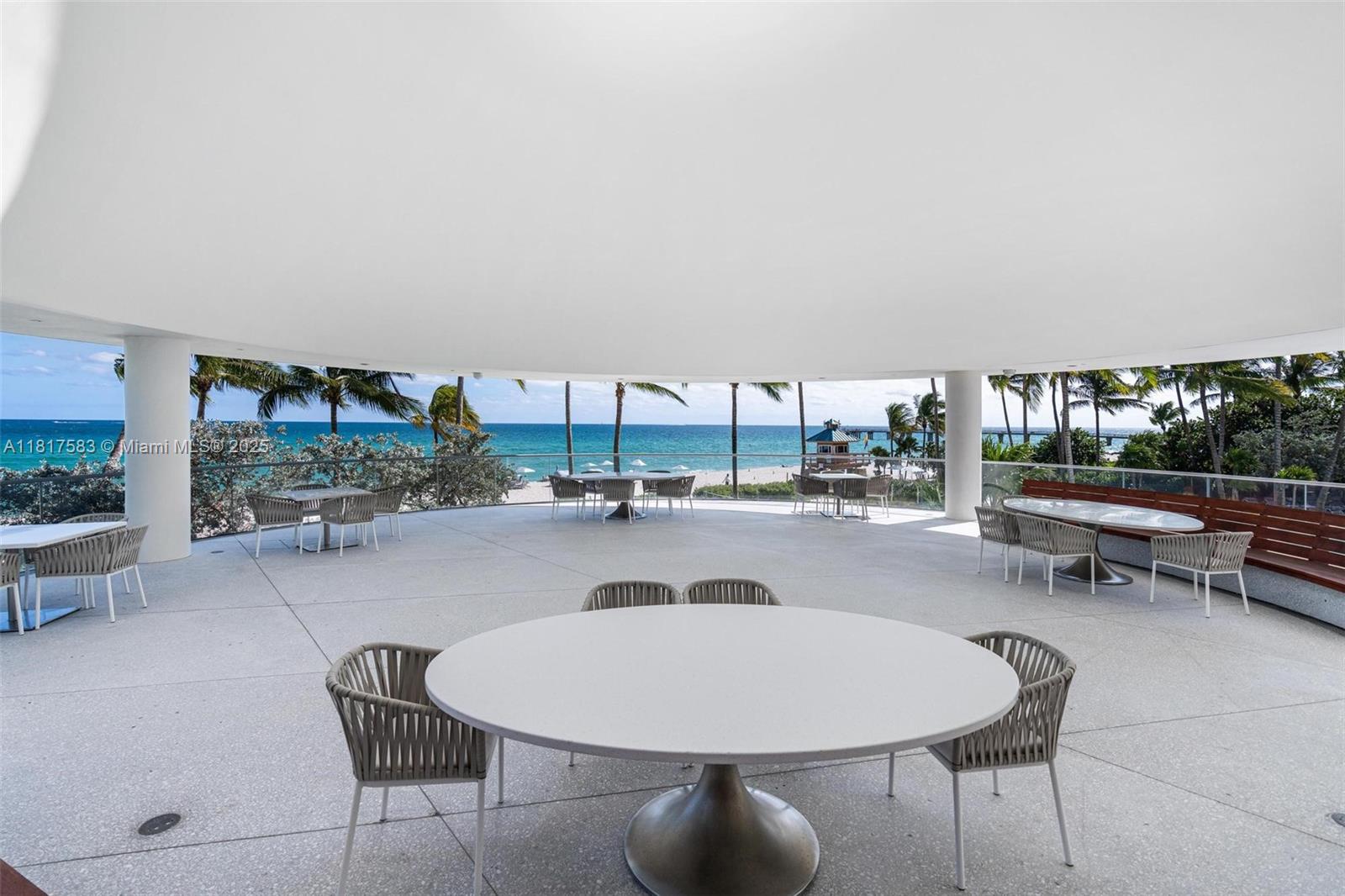 16901 Collins Avenue, Unit 902 Sunny Isles Beach, FL 33160 - Photo 42 of 52 a outdoor space with lots of table and chairs