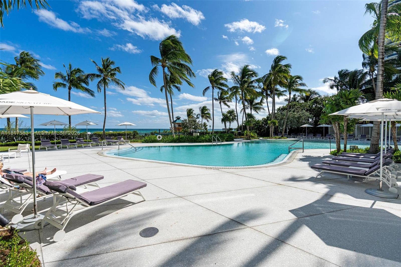 16901 Collins Avenue, Unit 902 Sunny Isles Beach, FL 33160 - Photo 43 of 52 a view of a swimming pool with a patio and a garden