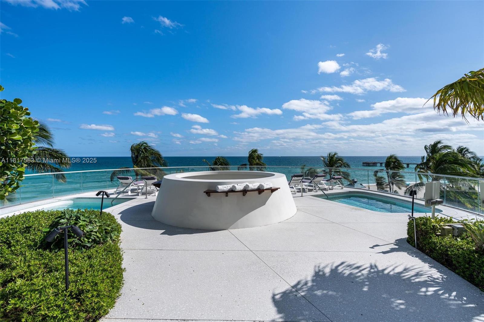 16901 Collins Avenue, Unit 902 Sunny Isles Beach, FL 33160 - Photo 49 of 52 a view of a swimming pool and lounge chair