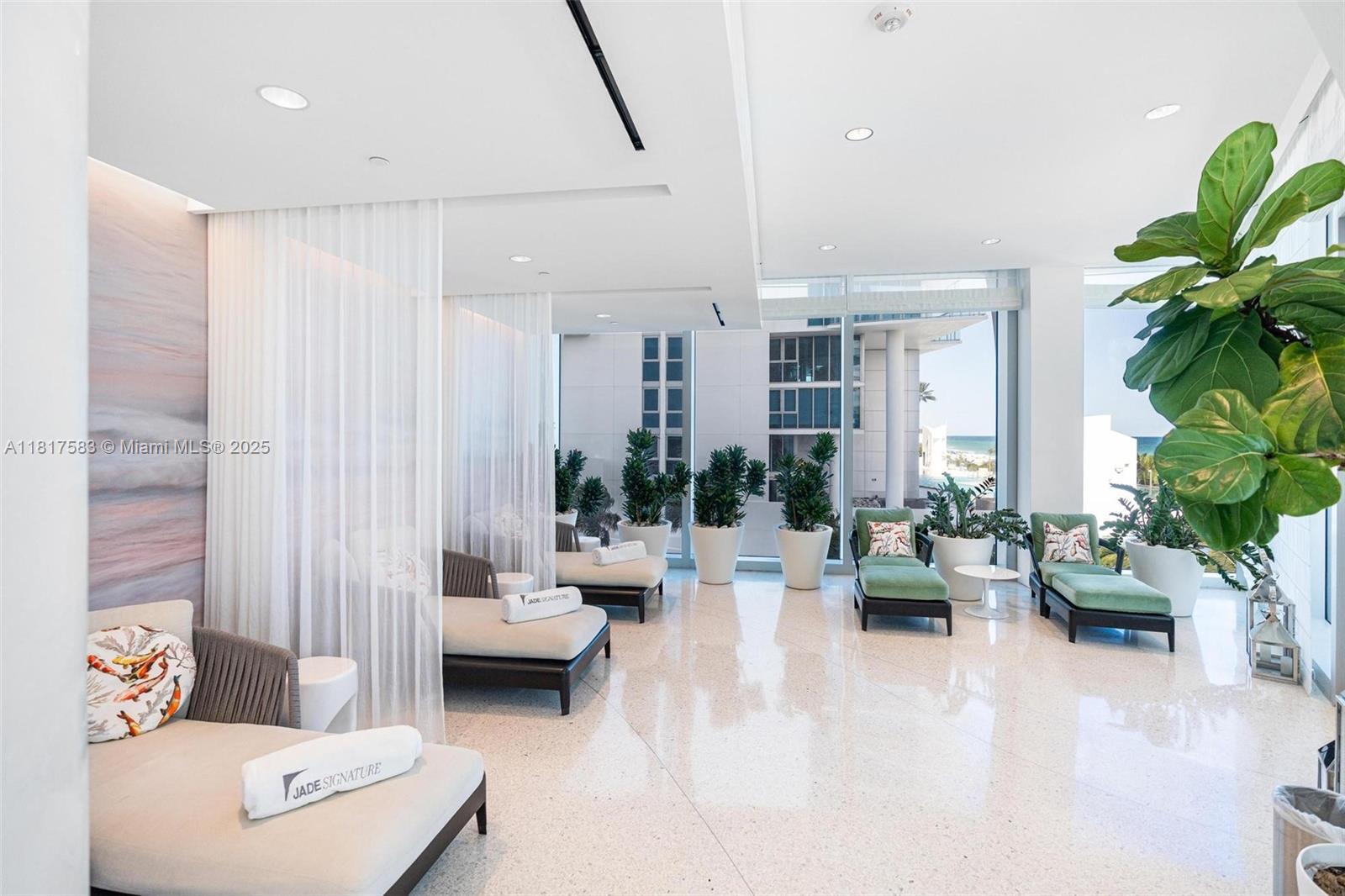 16901 Collins Avenue, Unit 902 Sunny Isles Beach, FL 33160 - Photo 50 of 52 a living room with furniture and a potted plant
