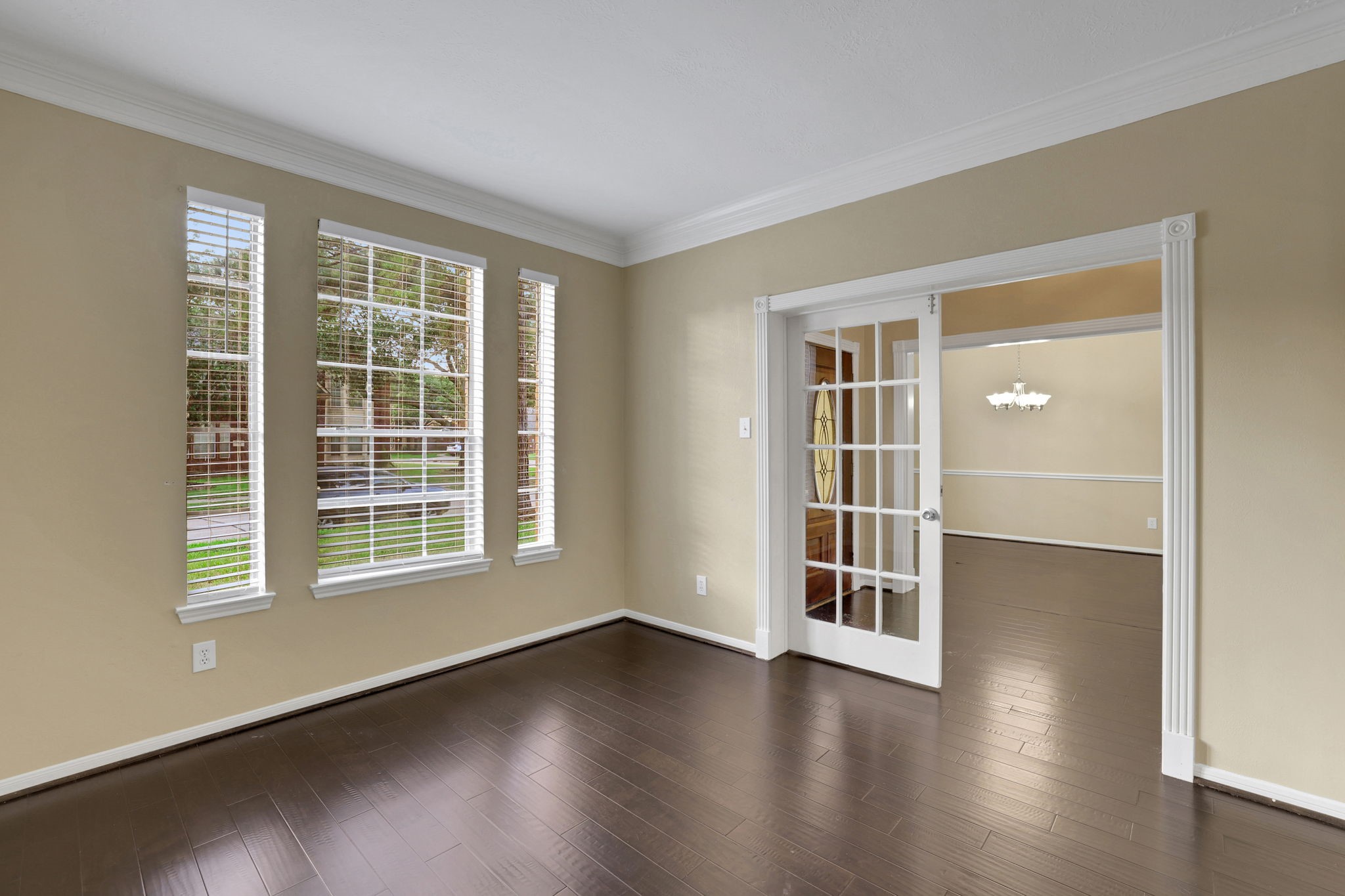 23207 Olive Ridge Court Katy, TX 77494 - Photo 5 of 46 an empty room with wooden floor and windows