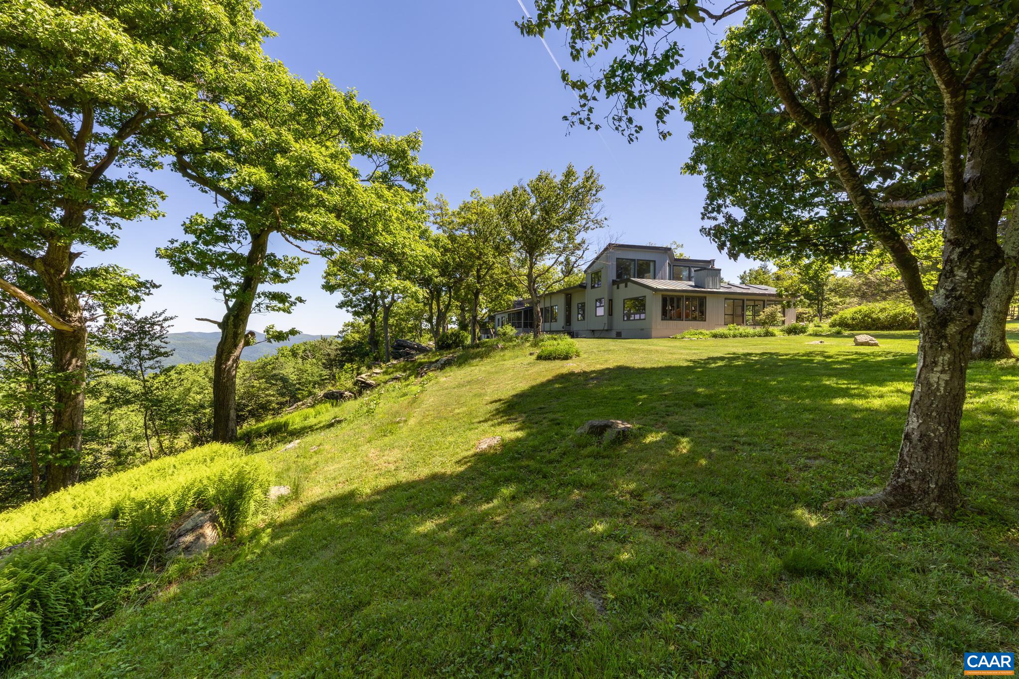 7098 Bucks Elbow Mountain Road Crozet, VA 22932 - Photo 50 of 57 a view of a big yard with a house