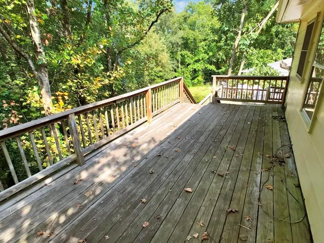 a view of a balcony with wooden floor