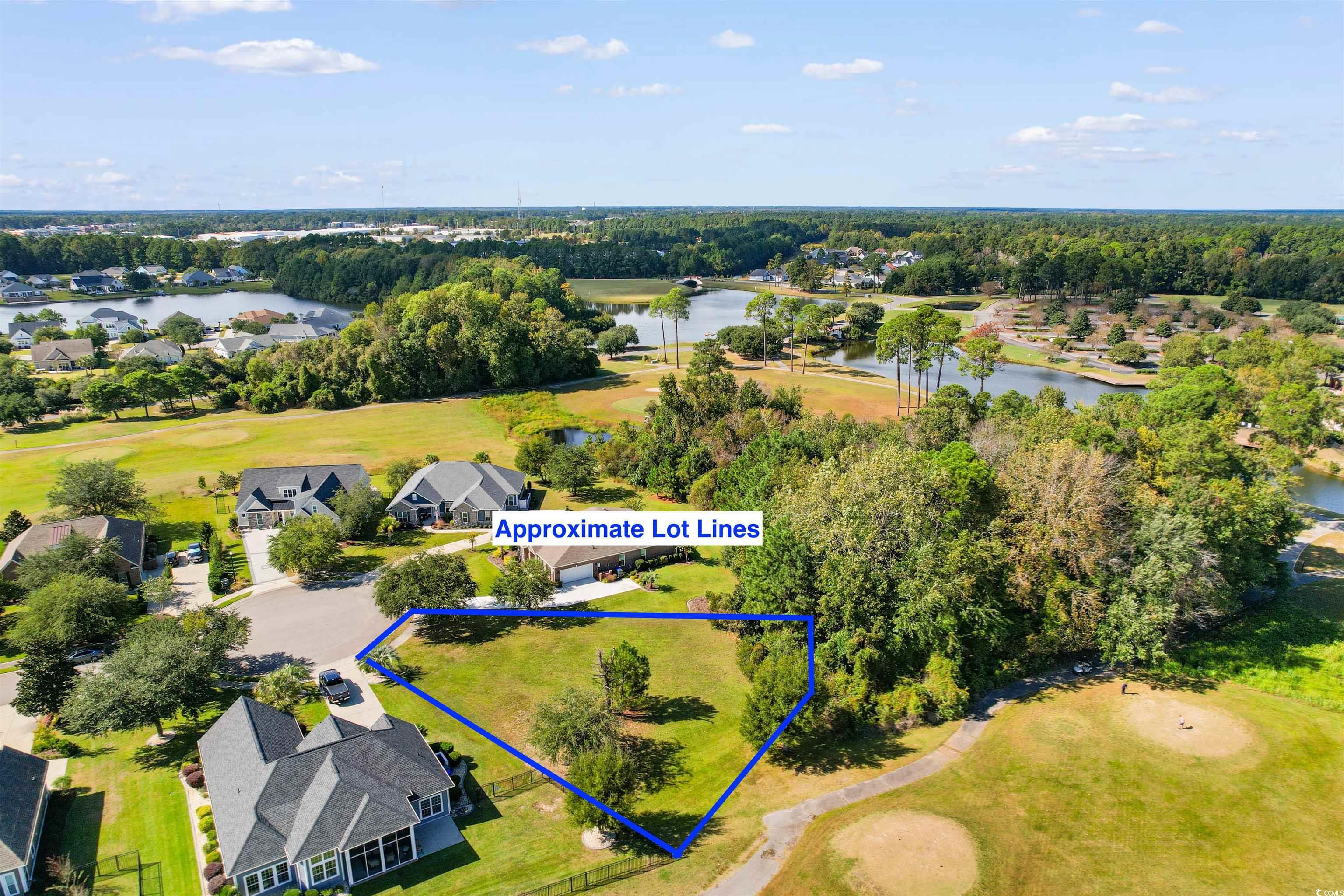1005 Whooping Crane Drive Conway, SC 29526 - Photo 17 of 35 Aerial view of residential area with property boundaries highlighted, a local golf course, and a large body of water