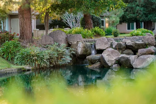 a view of a lake with huge green field