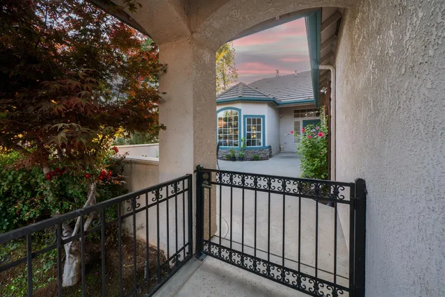 a view of a brick house with a large window