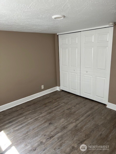 618 Cardinal Drive Walla Walla, WA 99362 - Photo 11 of 31 a view of an empty room with wooden floor