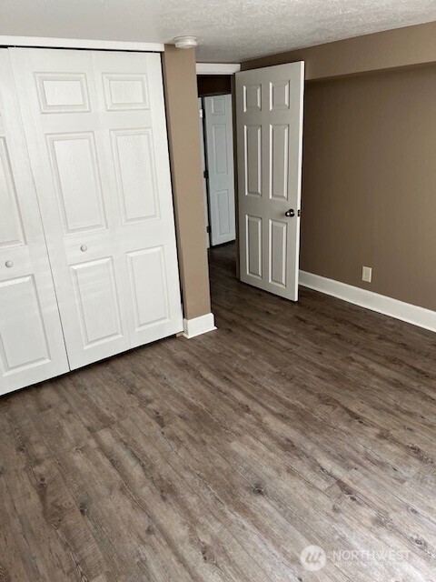 618 Cardinal Drive Walla Walla, WA 99362 - Photo 12 of 31 a view of an empty room with wooden floor