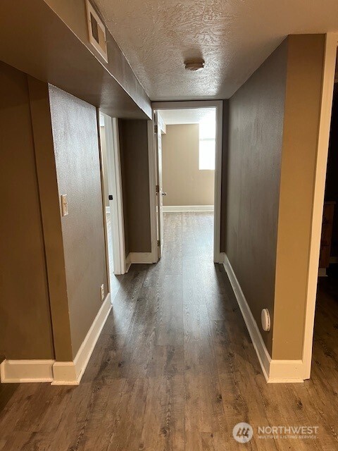 618 Cardinal Drive Walla Walla, WA 99362 - Photo 15 of 31 an empty room with wooden floor and a window