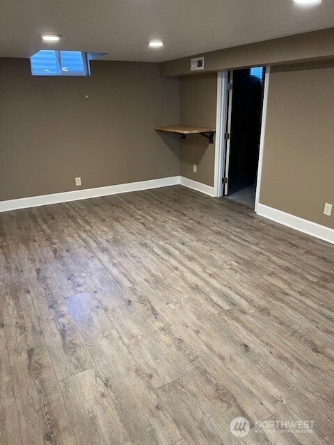 618 Cardinal Drive Walla Walla, WA 99362 - Photo 18 of 31 a view of an empty room with wooden floor