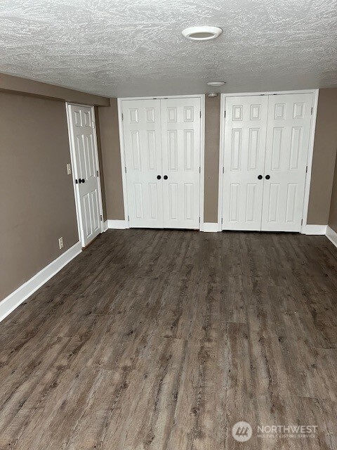 618 Cardinal Drive Walla Walla, WA 99362 - Photo 21 of 31 a view of an empty room with wooden floor