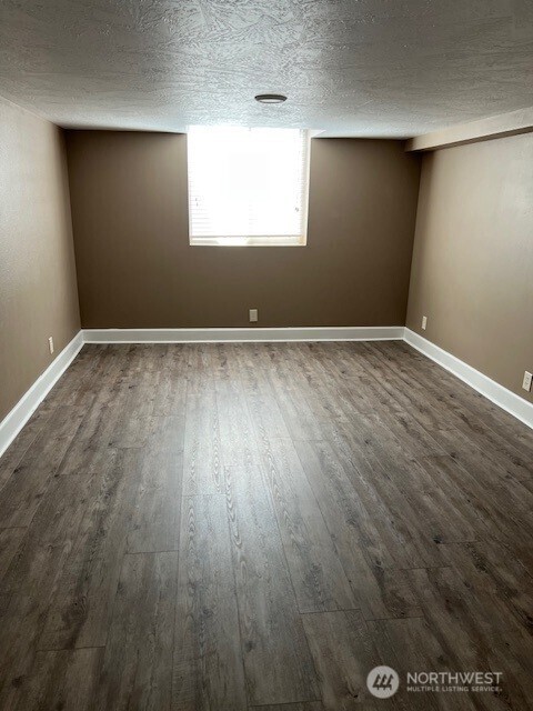 618 Cardinal Drive Walla Walla, WA 99362 - Photo 23 of 31 an empty room with wooden floor and windows