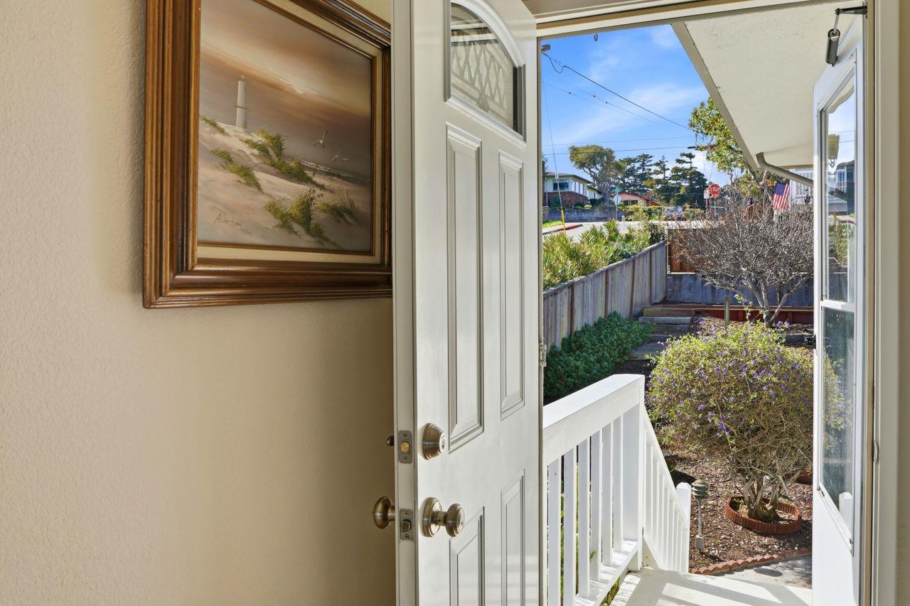 701 Archer Street Monterey, CA 93940 - Photo 23 of 39 a view of a house with a flower garden