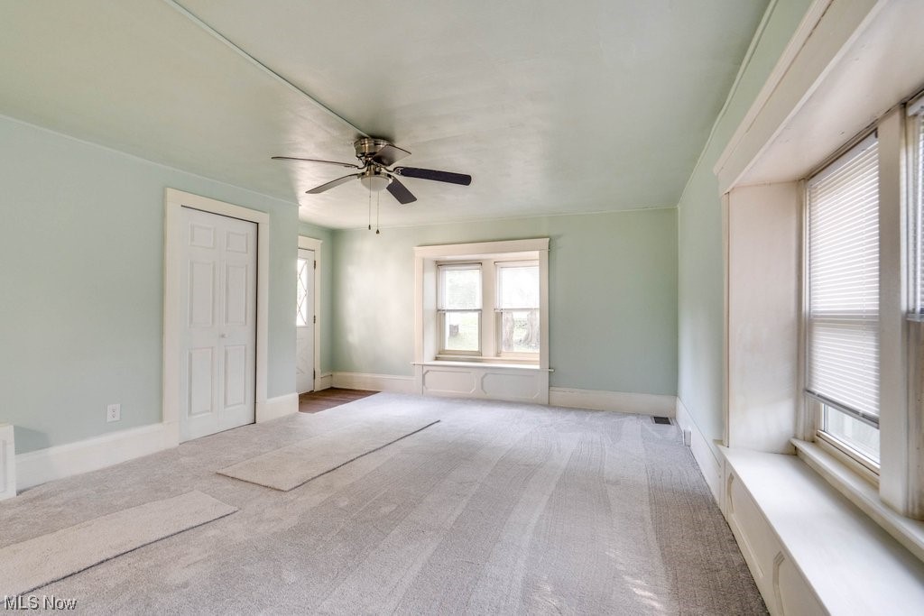 3775 East Waterloo Road Akron, OH 44312 - Photo 18 of 33 Unfurnished room featuring light carpet and ceiling fan