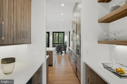 a view of staircase with lots of frames and flower garden