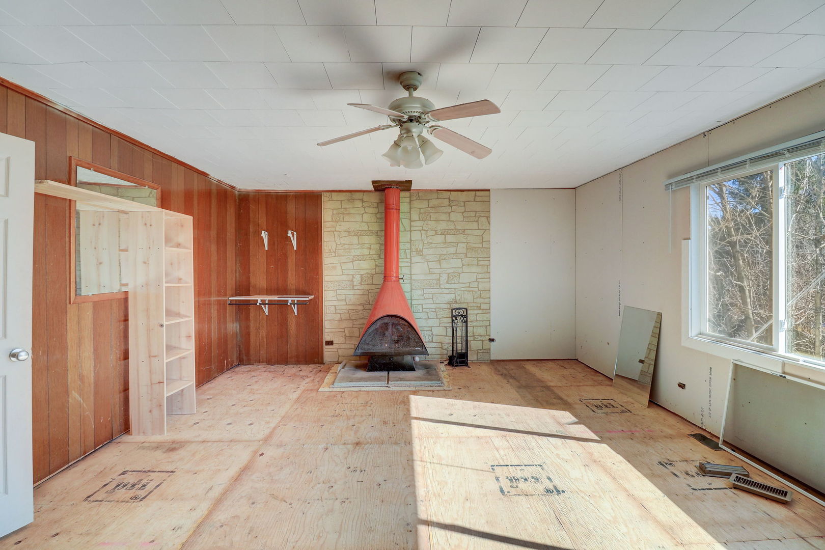 307 South Rosedale Court Round Lake, IL 60073 - Photo 15 of 41 a living room with a large window and a chandelier