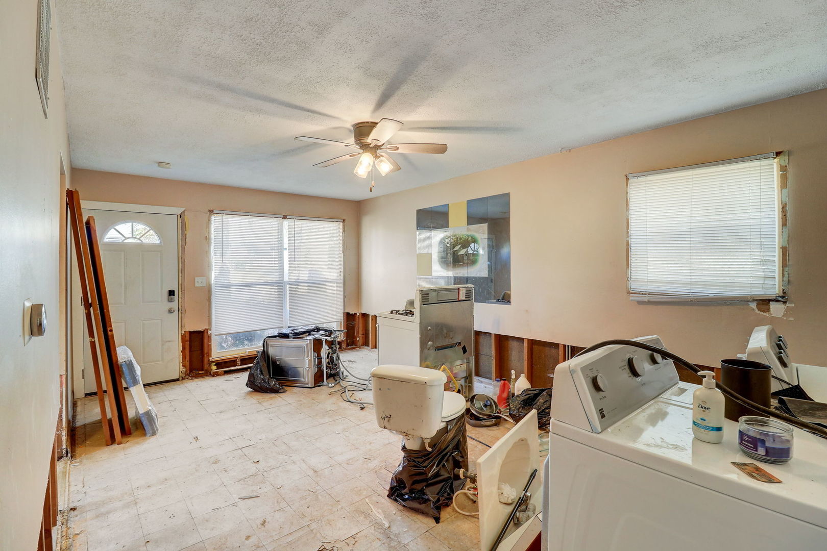 307 South Rosedale Court Round Lake, IL 60073 - Photo 6 of 41 a living room with furniture a flat screen tv and a large window