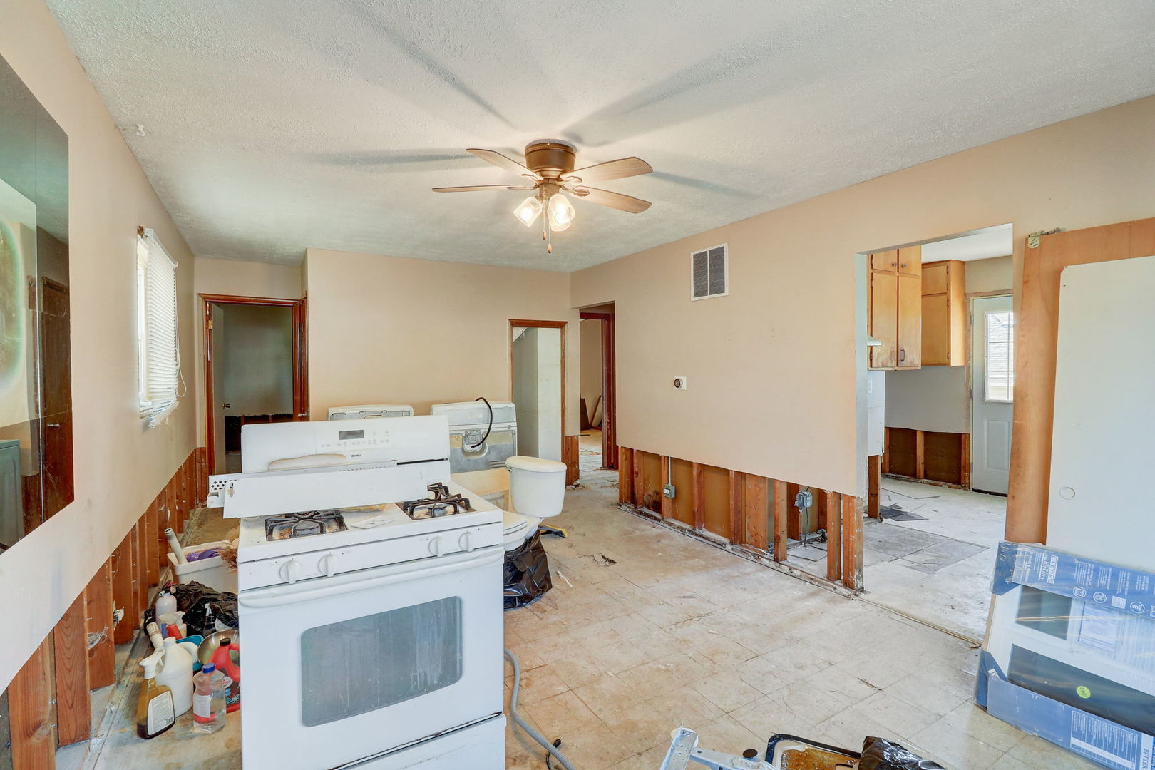307 South Rosedale Court Round Lake, IL 60073 - Photo 7 of 41 a view of washer and dryer with kitchen in the background