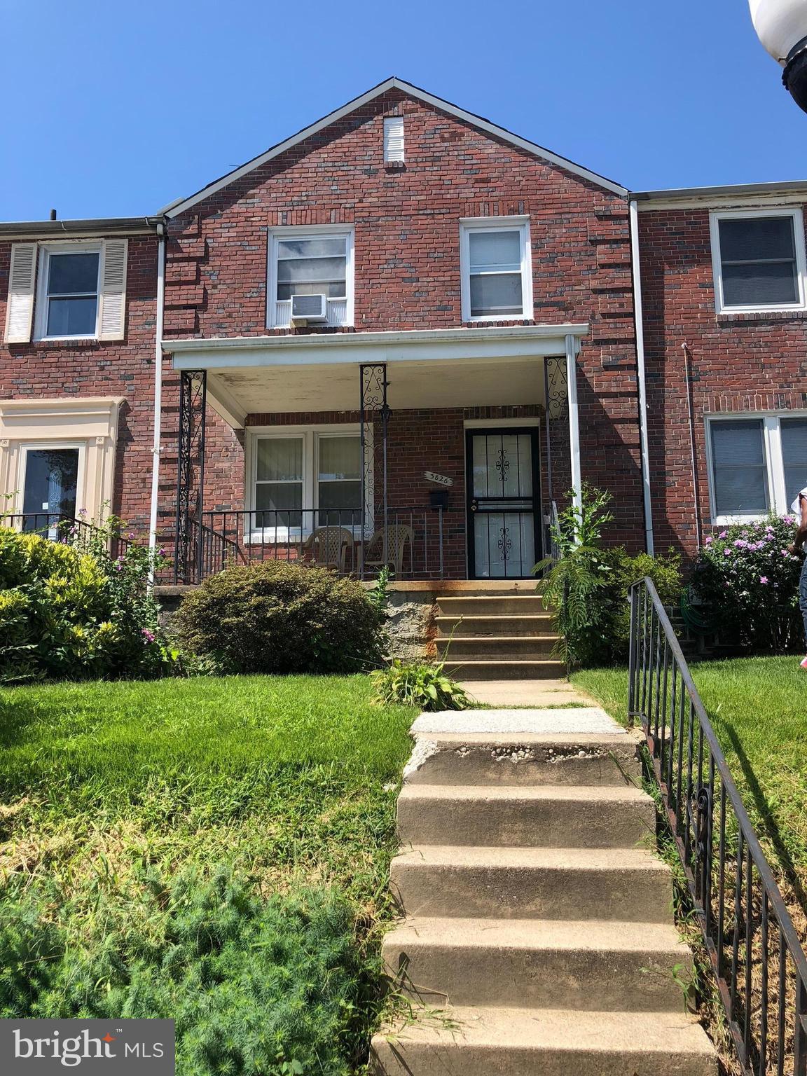 3826 Yolando Road Baltimore, MD 21218 - Photo 1 of 1 a front view of a house with a yard