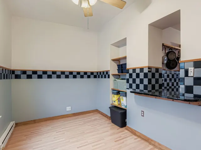 a kitchen with sink and cabinets