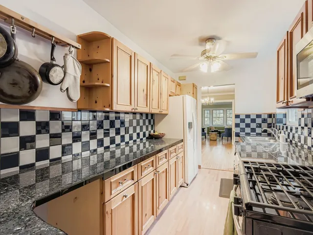 a kitchen with a sink and a stove top oven