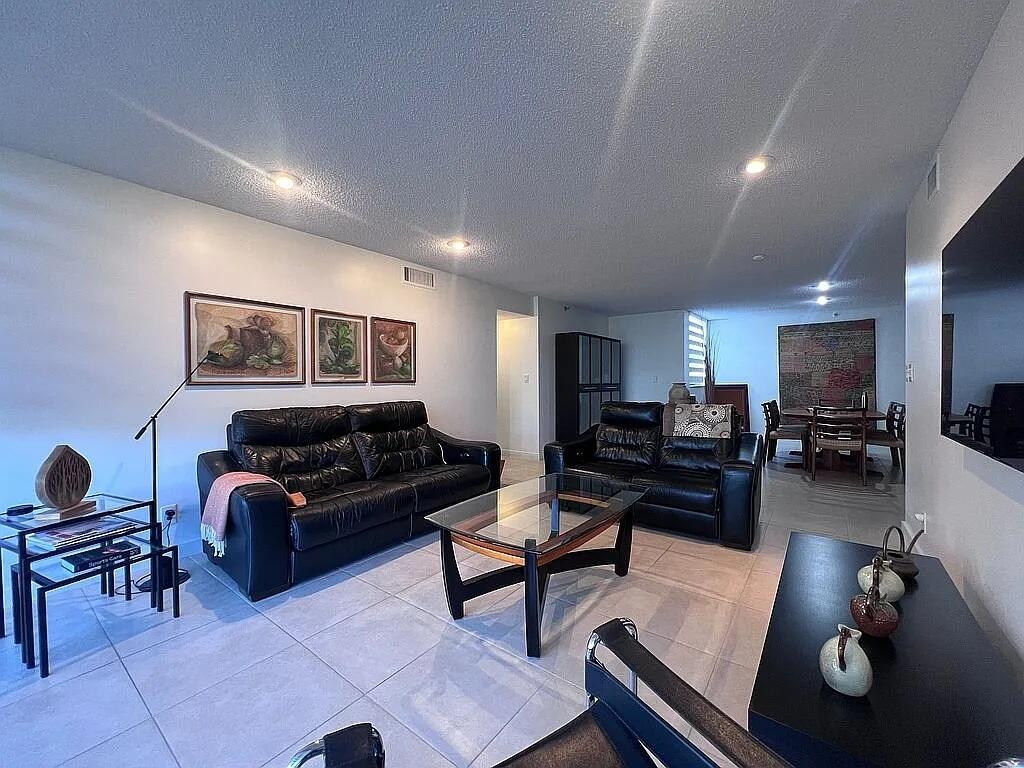 6463 La Costa Drive, Unit 105 Boca Raton, FL 33433 - Photo 9 of 40 a living room with furniture