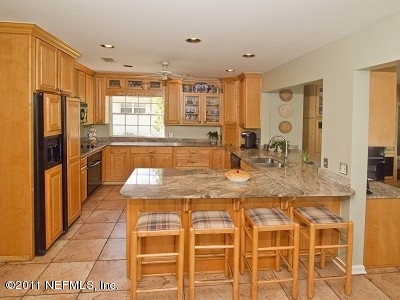 7540 Hollyridge Road Jacksonville, FL 32256 - Photo 8 of 31 Kitchen with bar stools