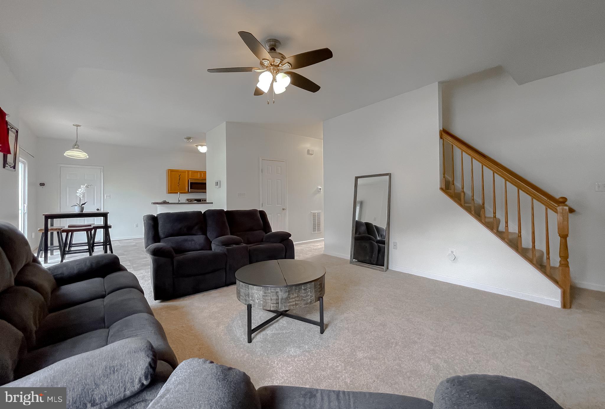 47162 Green Leaf Road Lexington Park, MD 20653 - Photo 12 of 50 a living room with furniture and a chandelier