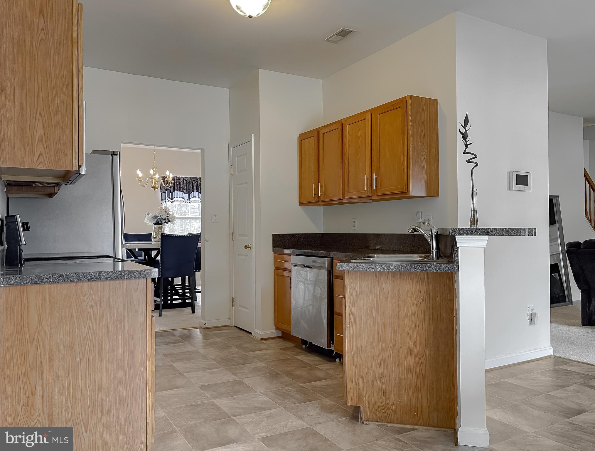 47162 Green Leaf Road Lexington Park, MD 20653 - Photo 16 of 50 a kitchen with a refrigerator and a stove