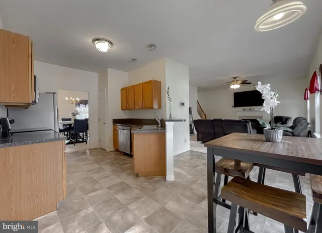 a kitchen with a refrigerator stove and microwave