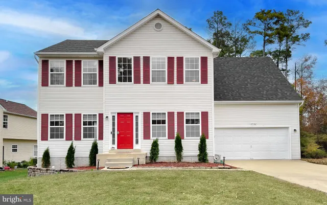 a view of house with yard