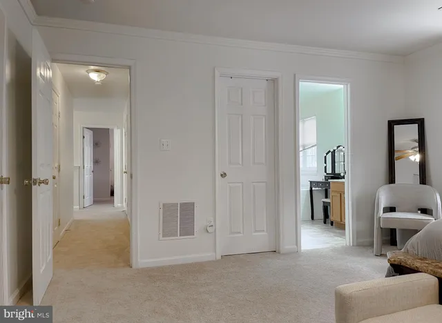 a bathroom with a double vanity sink mirror and toilet