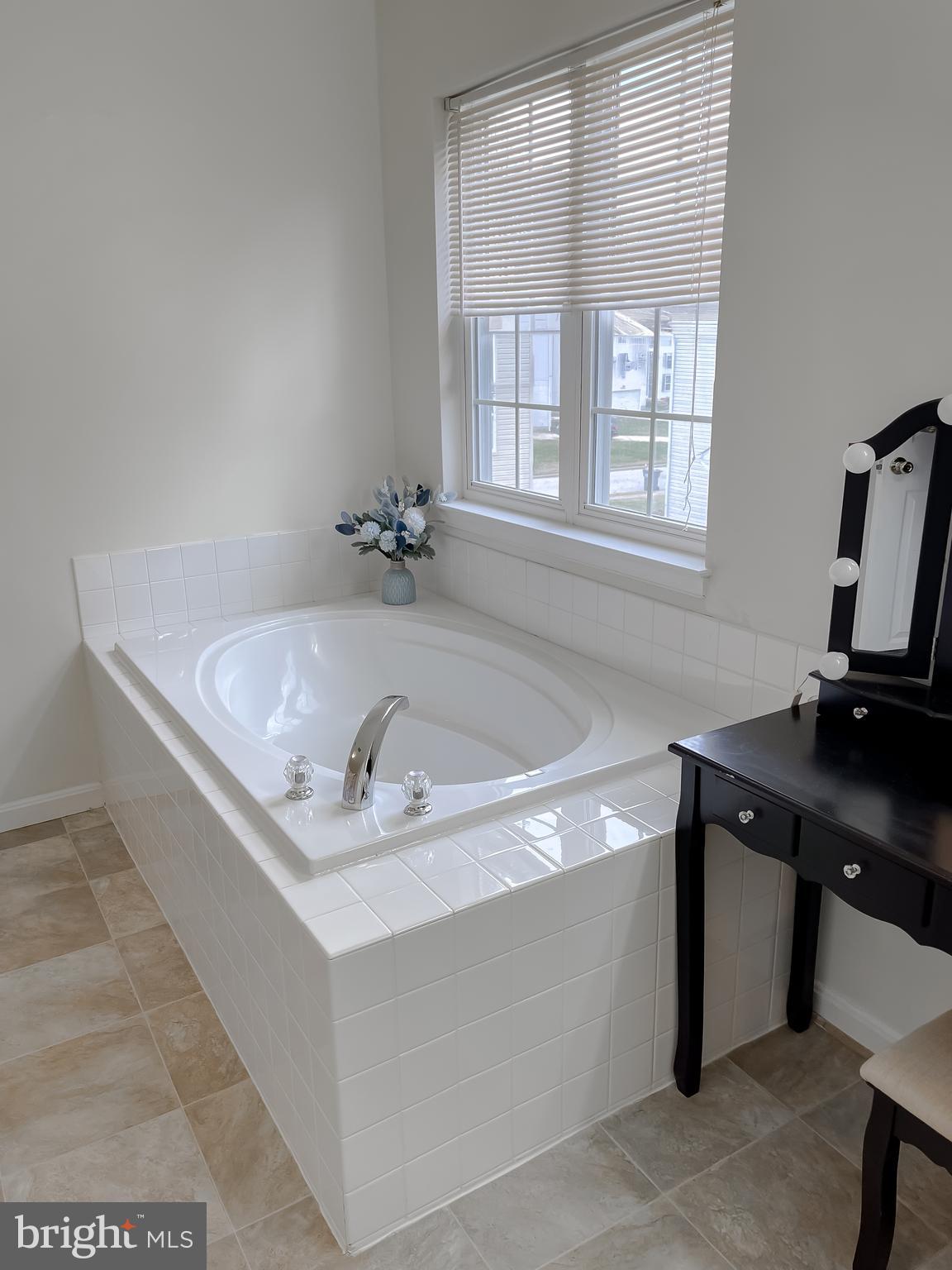 47162 Green Leaf Road Lexington Park, MD 20653 - Photo 31 of 50 a bath tub sitting in a bathroom next to a window
